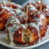 Fluffy glazed donuts stacked high and decorated with edible gold stars, creating a celebratory graduation party dessert.