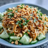 Delicious Cold Peanut Sesame Noodles, tossed with crunchy peanuts and fresh scallions.