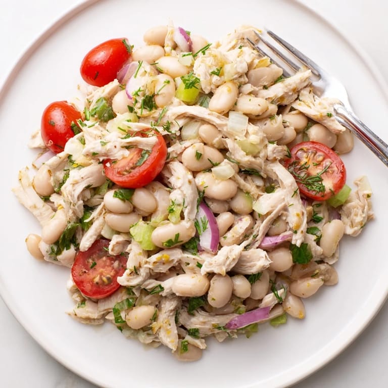 Serving suggestion for Lemony White Bean Chicken Salad, plated with a garnish of extra lemon zest, ready for a light lunch or dinner.