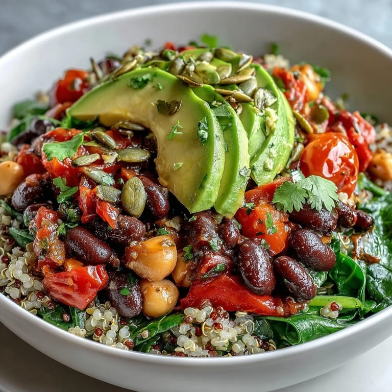 A close-up of Three-Bean Power Bowl with quinoa and zesty lemon dressing.